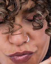 Fake nose piercing.